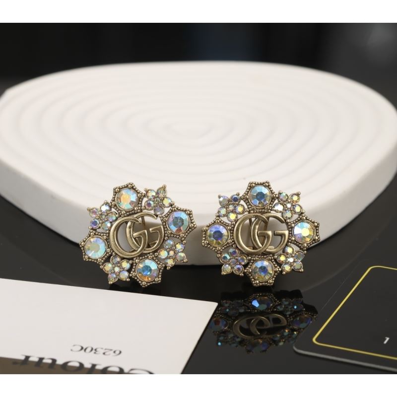 G*u*i earrings